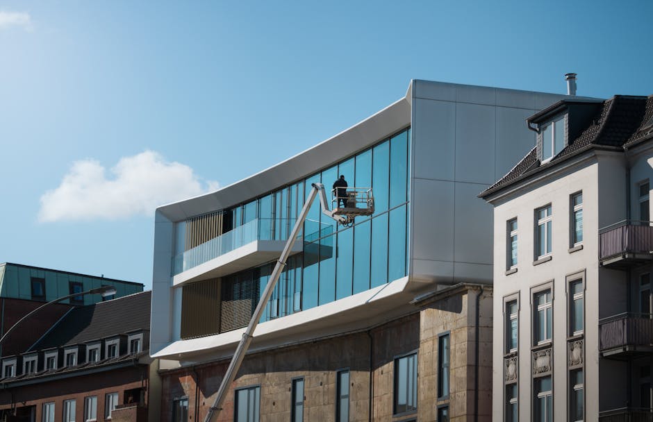 Modern architecture with glass facade in Hamburg, Germany under clear skies.